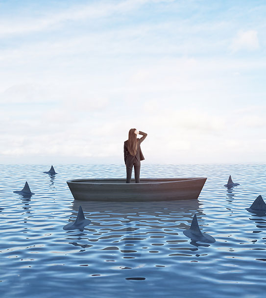 Strategy, leadership and competition concept with back view on businesswoman looking In the distance in a boat in the sea with sharks